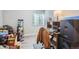 Unfinished basement with desk and chair provides versatile space for storage or hobbies at 940 S Peoria St, Aurora, CO 80012
