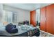Comfortable bedroom with large mirrored closet and ample natural light at 940 S Peoria St, Aurora, CO 80012