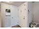 Hallway features two white doors on a gray wall with a calendar hung next to a doorway at 940 S Peoria St, Aurora, CO 80012