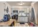 Galley kitchen featuring stainless steel appliances, updated cabinetry, and functional layout at 940 S Peoria St, Aurora, CO 80012