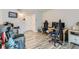 Comfortable living space with modern furniture, gaming chairs, and wood-look flooring at 940 S Peoria St, Aurora, CO 80012