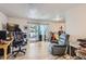 Bright living space with access to outdoor deck, comfortable seating, and entertainment setup at 940 S Peoria St, Aurora, CO 80012