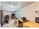 Open-concept living space featuring wood-look floors, dining area, and modern amenities at 940 S Peoria St, Aurora, CO 80012