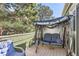 Comfortable outdoor patio with covered furniture and mature trees overhead at 940 S Peoria St, Aurora, CO 80012