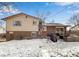 Brick home with backyard patio and grill, winter view at 8653 W 67Th Ave, Arvada, CO 80004