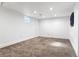 Spacious and bright finished basement room with neutral carpet at 8653 W 67Th Ave, Arvada, CO 80004