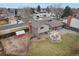 An aerial view showcasing the home's backyard, shed, and deck at 327 S 29Th Ave, Brighton, CO 80601