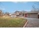 Large backyard with patio, deck, and grassy area at 327 S 29Th Ave, Brighton, CO 80601