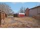 Backyard with a red shed and gravel area at 327 S 29Th Ave, Brighton, CO 80601