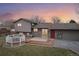 House exterior and backyard with deck and patio at 327 S 29Th Ave, Brighton, CO 80601