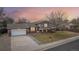 Two-story house with attached garage and landscaping at 327 S 29Th Ave, Brighton, CO 80601