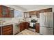 Updated kitchen with stainless steel appliances and wood cabinets at 327 S 29Th Ave, Brighton, CO 80601