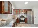 Updated kitchen featuring granite countertops and wood cabinets at 327 S 29Th Ave, Brighton, CO 80601