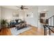 Bright living room with hardwood floors and a view into the kitchen at 327 S 29Th Ave, Brighton, CO 80601