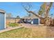 Charming backyard featuring a patio, pergola, grill, and lush landscaping at 4441 Elm Ct, Denver, CO 80211
