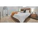 Comfortable bedroom with a large bed, stylish decor and soft carpeting at 4441 Elm Ct, Denver, CO 80211
