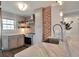 Bright kitchen with stainless appliances, marble countertop, brick accent wall at 4441 Elm Ct, Denver, CO 80211