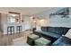 Comfortable living room next to kitchen featuring hardwood floors, neutral decor at 4441 Elm Ct, Denver, CO 80211