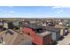 Aerial view of the community, highlighting the rooftop deck, neighborhood, and mountain views at 6047 N Nepal Ct, Aurora, CO 80019