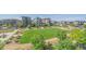 Aerial view of a manicured community park surrounded by modern homes on a sunny day at 6047 N Nepal Ct, Aurora, CO 80019