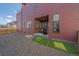 Low-maintenance backyard offers a modern aesthetic with gravel, artificial turf, and a covered patio at 6047 N Nepal Ct, Aurora, CO 80019