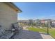 Cozy balcony with stylish furniture overlooking green space and neighborhood at 6047 N Nepal Ct, Aurora, CO 80019