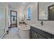 Elegant bathroom with a soaking tub, glass shower, and dual vanities at 6047 N Nepal Ct, Aurora, CO 80019