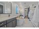 Luxurious bathroom with a soaking tub, dual vanities, and a glass-enclosed shower at 6047 N Nepal Ct, Aurora, CO 80019