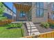 Charming front entrance with concrete steps, stone veneer, and manicured landscaping at 6047 N Nepal Ct, Aurora, CO 80019