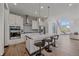 Contemporary kitchen with an island, bar stool seating, and modern appliances at 6047 N Nepal Ct, Aurora, CO 80019