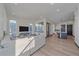Open concept living room with hardwood floors and lots of natural light at 6047 N Nepal Ct, Aurora, CO 80019