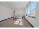 Cozy living room with a sofa, large windows, and plenty of space at 6047 N Nepal Ct, Aurora, CO 80019