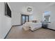 Spacious main bedroom with a king bed, private balcony, and plenty of natural light at 6047 N Nepal Ct, Aurora, CO 80019