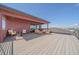 Expansive rooftop deck with outdoor seating and unobstructed views of the landscape at 6047 N Nepal Ct, Aurora, CO 80019