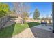 Spacious backyard with terraced levels, lawn, and patio for entertaining at 2905 E Yarrow Cir, Superior, CO 80027