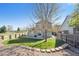 Well-maintained backyard with green lawn, patio area, and privacy fence at 2905 E Yarrow Cir, Superior, CO 80027