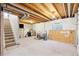 Unfinished basement featuring exposed beams, carpeted floors, and ample space for storage or customization at 2905 E Yarrow Cir, Superior, CO 80027