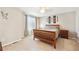 Bedroom has neutral walls and carpeting with a wood-framed bed at 2905 E Yarrow Cir, Superior, CO 80027