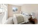 Well-lit bedroom with stylish decor, plush pillows, and a decorative rug at 2905 E Yarrow Cir, Superior, CO 80027