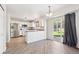 Bright eat-in kitchen with white cabinets, stainless steel appliances, and sliding door to backyard at 2905 E Yarrow Cir, Superior, CO 80027