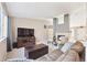 Comfortable living room featuring a fireplace, plush seating, and modern decor at 2905 E Yarrow Cir, Superior, CO 80027