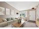 Bright living room featuring neutral tones, bay window, and contemporary decor at 2905 E Yarrow Cir, Superior, CO 80027