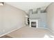 Spacious living room featuring a cozy fireplace and neutral carpeting at 2905 E Yarrow Cir, Superior, CO 80027