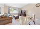 Cozy living room with plush seating and a large window providing ample natural light at 2905 E Yarrow Cir, Superior, CO 80027