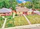 Aerial view showcasing the property with a well-manicured lawn and established trees at 1600 Xanthia St, Denver, CO 80220