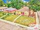 Aerial view of a charming home with lush greenery and a well-maintained lawn at 1600 Xanthia St, Denver, CO 80220