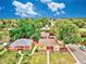 Aerial view of the neighborhood with mature trees and well-maintained lawns at 1600 Xanthia St, Denver, CO 80220
