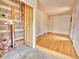 Exposed basement with unfinished walls, plumbing, and open doorway to another room at 1600 Xanthia St, Denver, CO 80220