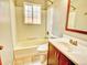 Bathroom featuring a bathtub/shower combination, toilet, and vanity sink at 1600 Xanthia St, Denver, CO 80220