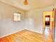 Bright bedroom with hardwood floors and natural light from a window, plus a closet at 1600 Xanthia St, Denver, CO 80220